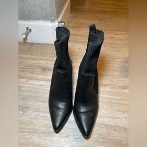 Black booties. Sock type at the top. Barley worn. Block heel